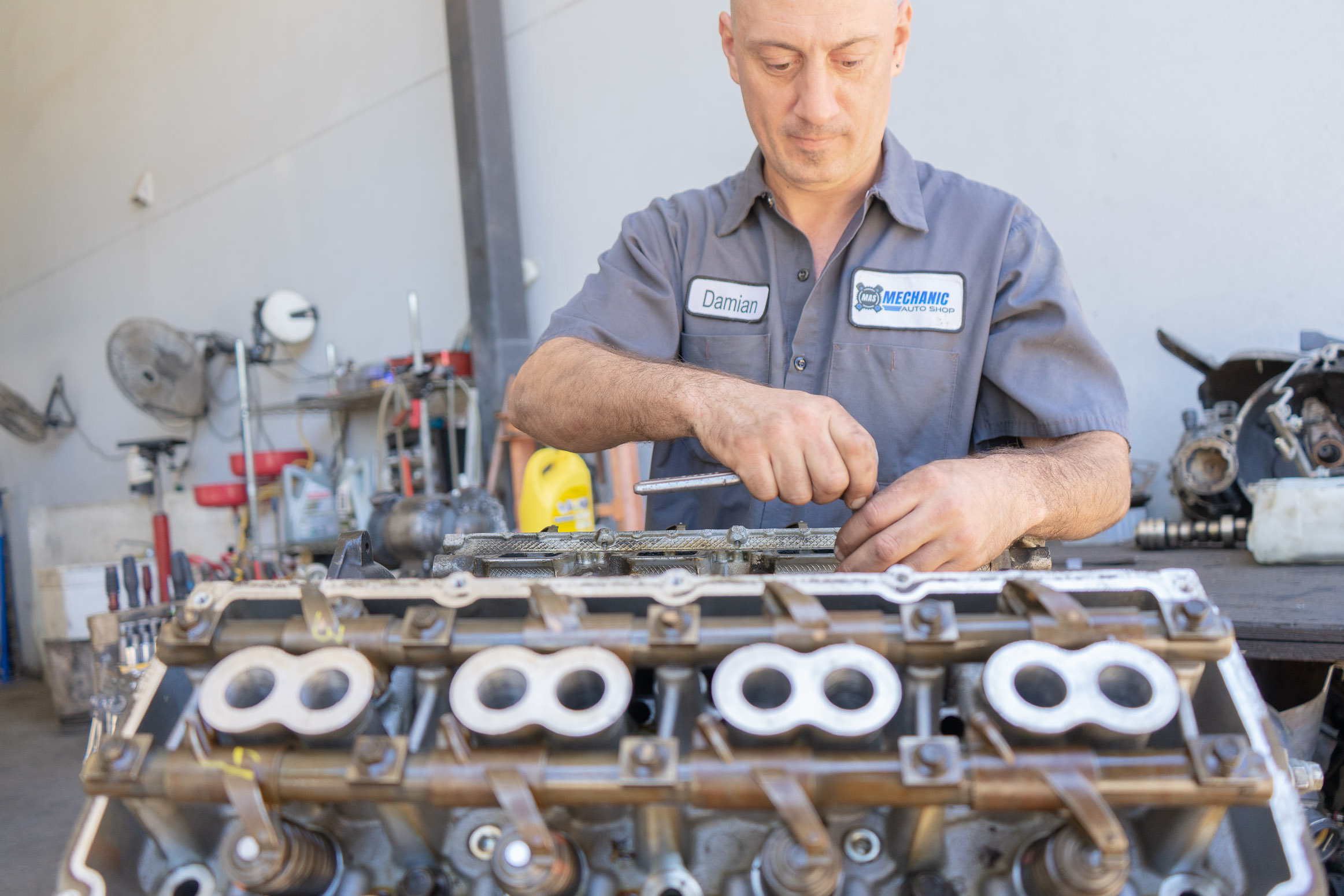 Engine Repair and Maintanence Mechanic technician fixing engine.